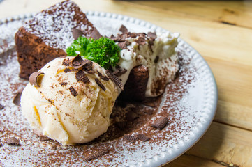 ice cream Vanilla chocolate pie whippin creamy tasty dessert on wood table in cafe ready to eat in restaurant.