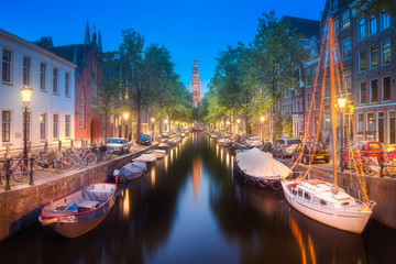River, traditional old houses and boats, Amsterdam