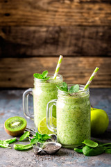 green smoothie with spinach, apple, kiwi, lime and chia seeds. healthy diet eating, superfood