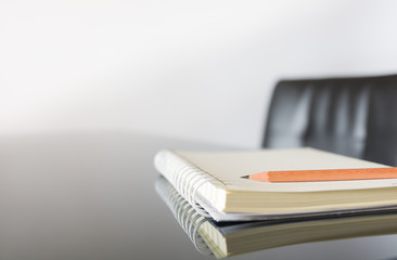 Notebook with a pencil