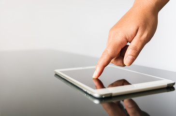closeup hand using tablet