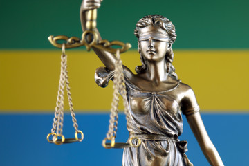 Symbol of law and justice with Gabon Flag. Close up.