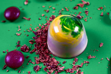 Top view of set of beautiful and delicious chocolate sweets decorated with assorted chocolate crumbs