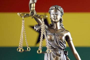 Symbol of law and justice with Ghana Flag. Close up.
