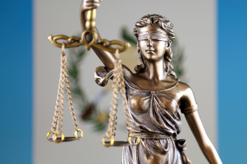 Symbol of law and justice with Guatemala Flag. Close up.