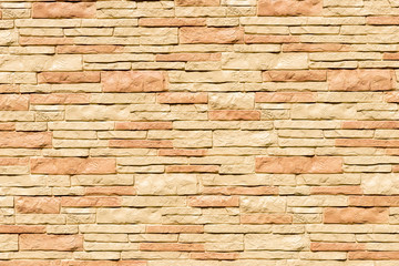 background - beige stone facade decoration close-up