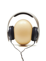 Fototapeta na wymiar Ostrich egg with headphones over it