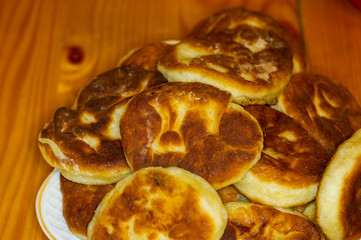 Russian pirozhki, fresh fried pasties stuffed with potatoes