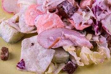 The vegetable salad with the pieces of a turkey fried by croutons seasoned with sour cream sauce