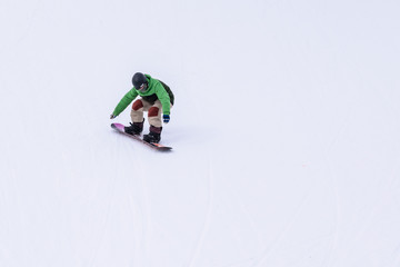 People are having fun in downhill skiing and snowboarding