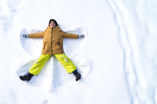 Boy Makes Snow Angel, Copy Space