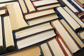Fototapeta premium Stack of books background. many books piles.