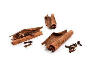 Cinnamon and cloves isolated on a white background stock photo images. Cinnamon and clove isolated on white background. Aromatic spice collection