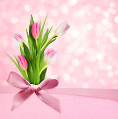 Pink background with silk bow and flowers