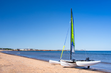 Small Catamaran Waiting on Beach