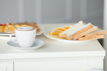 Breakfast in bed in hotel room. Accommodation.