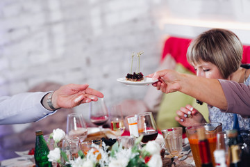 Festive people clinking glasses