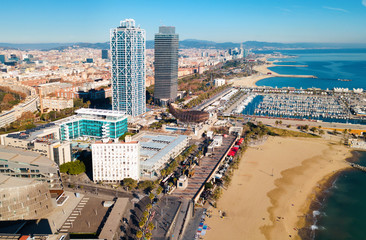 Fototapeta na wymiar Aerial view of Barcelona with skyscrapers on coast