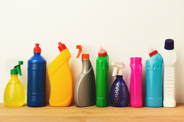 Group of colorful cleaning products on white background