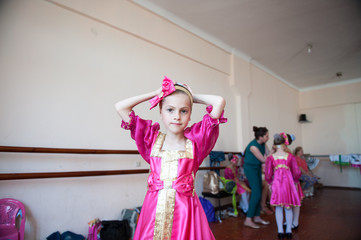 beautiful little girl in Russian national costume at the school dance