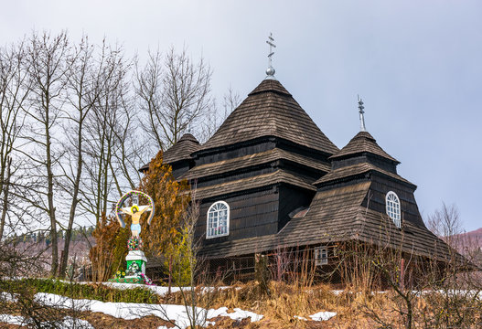 Uzhok, Ukraine - February 25, 2017: Church of the Archangel Michael - UNESCO World Heritage. old wooden building in Carpathian mountains in winter
