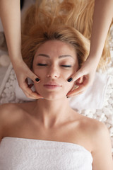 Young beautiful woman at the spa salon