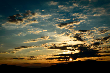 Fototapeta na wymiar Sunset landscape with beautiful colors and clouds