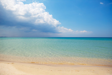 clear water in the sea, Sunny day, horizon. clear sea water, sandy beach in Sunny weather. with big clouds on the horizon. the concept of rest