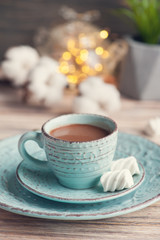 Obraz na płótnie Canvas Cup of hot chocolate and lights