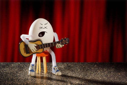 Funny egg guitarist plays guitar