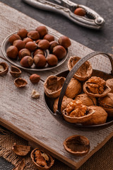 Walnuts and pine nuts on a cutting board