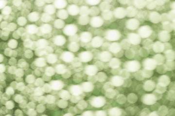 Obraz premium Abstract green blurred bokeh background from water drops