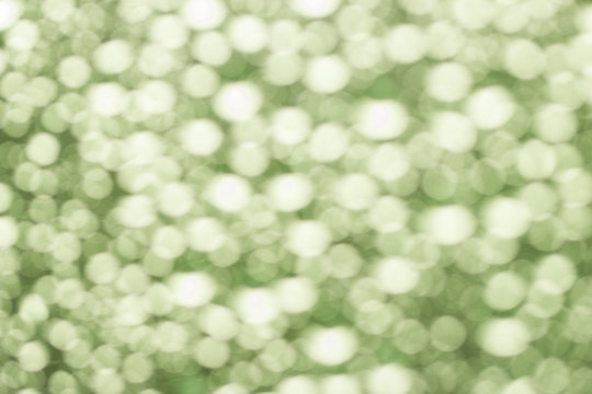 Abstract green blurred bokeh background from water drops