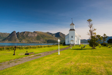 White church and small cemetery in Bardstrand,Norway