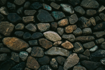 Background texture of stone wall. Fragment of a wall from a chipped stone
