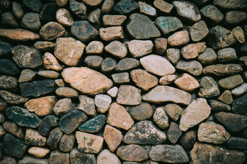 Black and White background texture of stone wall. Fragment of a wall from a chipped stone