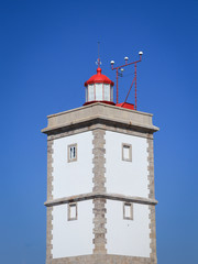 Lighthouse with a blue sky in background. Peniche Portugal