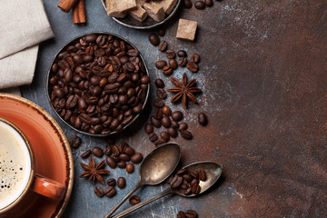 Obraz na płótnie Canvas Coffee cup, beans, sugar and spices