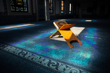 Quran - holy book of muslims, scene in the mosque at Ramadan time