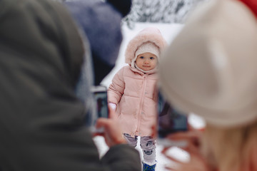 happy family doing a photo of her little daughter