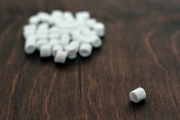 white marshmallow on a wooden background