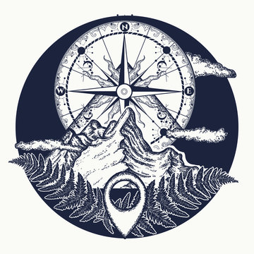 Mountain top and vintage compass tattoo and t-shirt design. Mountains and compass tattoo. Symbol of tourism, rock climbing, camping