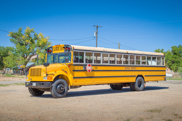 Fototapeta na wymiar Traditional yellow school bus in North America