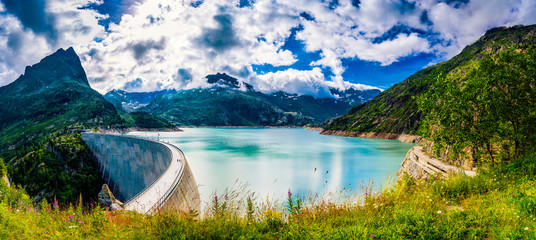 Panorama of the dam at Lake Emosson near Chamonix (France) and Finhaut (Switzerland) during a sunny summer day - obrazy, fototapety, plakaty