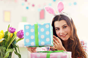 Attractive woman with Easter presents