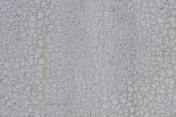 gray cracked paint on a metal surface, background, texture
