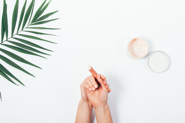 Woman put the cream on her hands