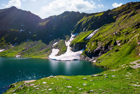 lake Balea in Fagaras mountains on a bright sunny day. amazing summer landscape of one of the most visited landmarks in Romania