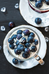 Blueberry coconut yogurt dessert garnished with fresh fruit