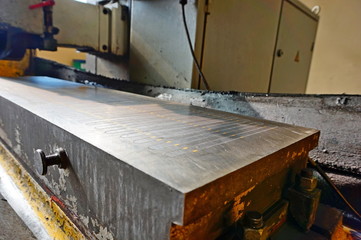 Magnetic plate on the grinding machine. Electric magnetic sine table.